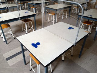 The white dining table has an acrylic plate in the middle.