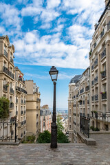 Paris, romantic staircase in Montmartre, typical buildings and floor lamp
