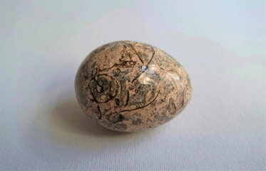 Stone egg on white background, Easter egg 