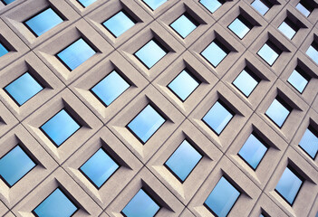 Blue Windows Architecture Symmetric Pattern on Modern Building Exterior - 392567864