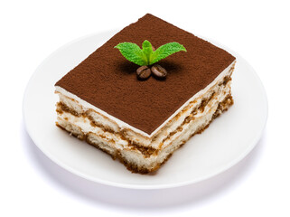Traditional Italian Tiramisu square dessert portion on ceramic plate isolated on white background with clipping path