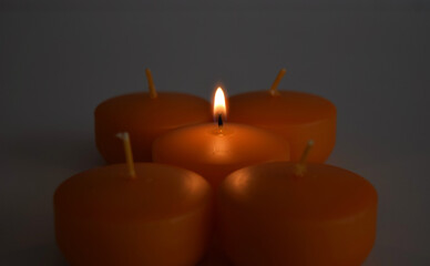 Beautiful orange candles on the white background
