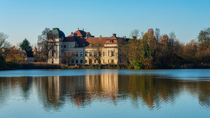 Fototapeta na wymiar Ruegers Castle with its splendit Baroque structure. Ruegers Castle (German: Schloss Ruegers) is nestled in a pond landscape near the Czech border. 