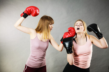 Two agressive women having boxing fight