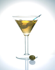 glass with a drink and olives