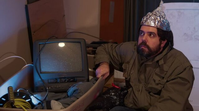 paranoid guy with a tin foil hat