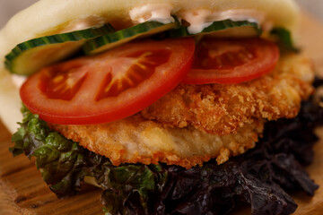 Steamed wheat bun dressed with designer sauce. Vietnamese cuisine concept. Still life. Close-up.