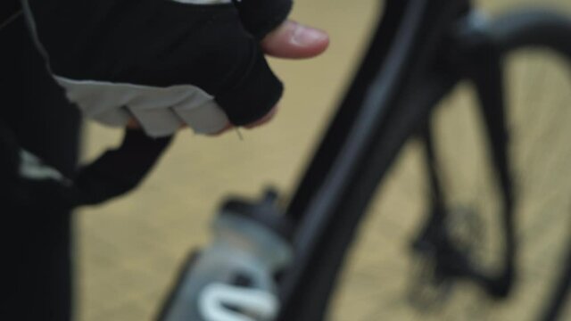 male hands on the combination lock pick up a combination of numbers and open it. bike locks concept