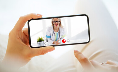 Person calling doctor via video call on the phone