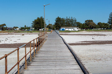 Obraz premium The kingston jetty located on the limstone coast looking back towards the town in south australia on November 8th 2020
