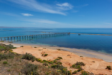 The iconic port noarlunga jetty and reef at low tide on a calm sunny day in South Australia on...