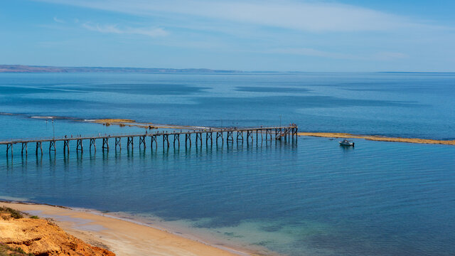 The iconic port noarlunga jetty and reef at low tide on a calm sunny day in South Australia on November 2 2020