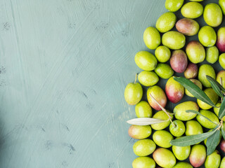 Freshly picked raw green olives. Food texture flat background.