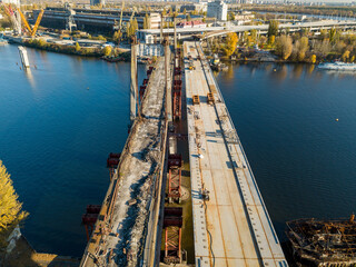 Bridge construction site in Kiev. Sunny autumn morning. Aerial drone view.