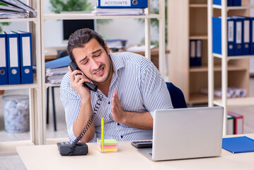 Hungry male employee ordering food at workplace