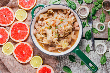 Potato stew with meat on the table, restaurant dish on a wooden background