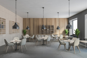 Grey cafe with chairs and wooden table with pendant lamps, wooden wall and grey floor