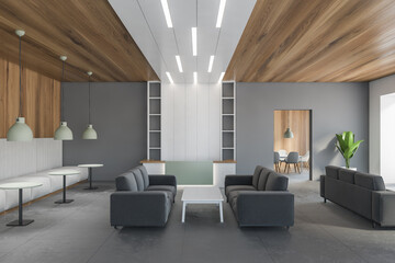 Wooden and grey waiting room with grey sofa and reception desk