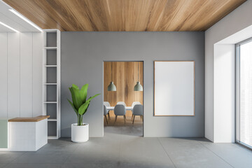 Mockup canvas on grey wall near office reception in hall and meeting room