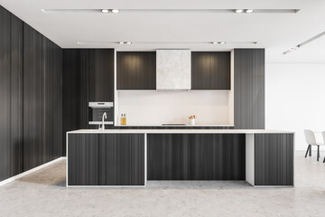 Black kitchen set with grey floor in modern stylish minimalist apartment