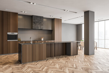 Wooden kitchen set with parquet floor in modern stylish minimalist apartment
