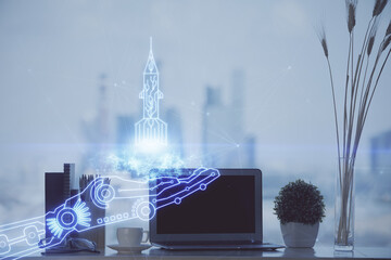 Desktop computer background in office and start up theme hologram drawing. Double exposure. Startup...