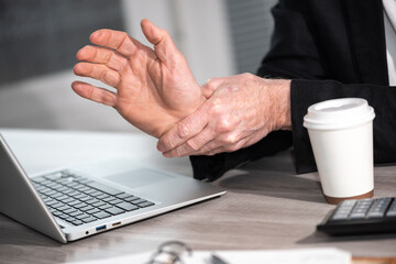 Man suffering from wrist pain