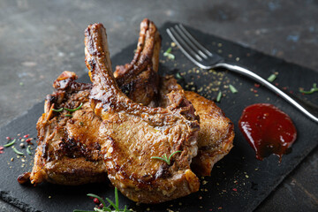 Fried pork steak with spicy sauce and herbs