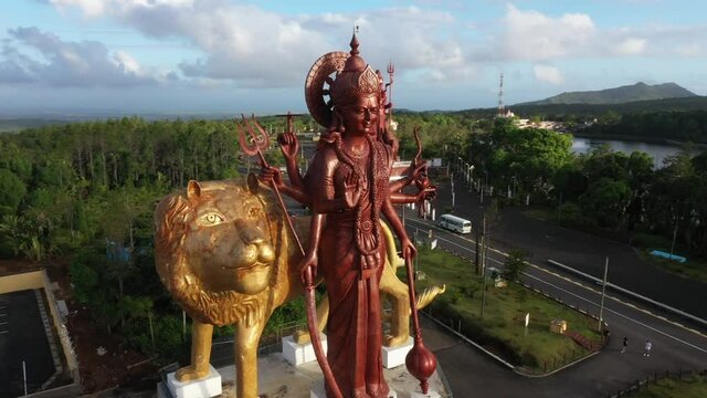 Flying around the Durga Mata monument in Ganga Talao in Mauritius