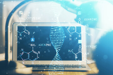 Desktop computer background and DNA drawing. Double exposure. Science concept.