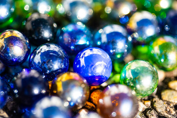 Playing marbles, old children's game, colorful balls