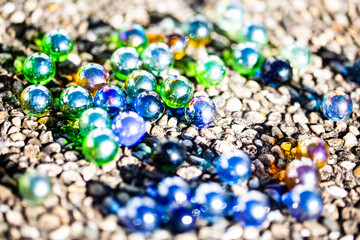 Playing marbles, old children's game, colorful balls