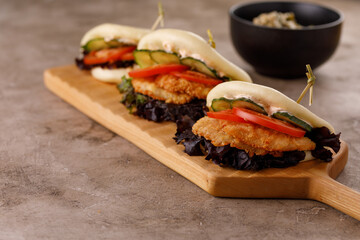Steamed wheat bun dressed with designer sauce. Vietnamese cuisine concept. Still life. Close-up.