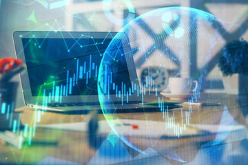 Financial graph colorful drawing and table with computer on background. Multi exposure. Concept of...