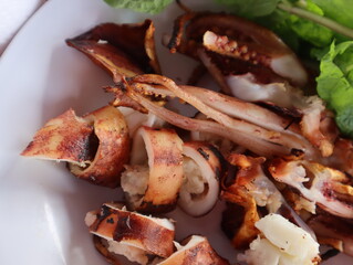 Squid with eggs cut into a plate ready to eat.