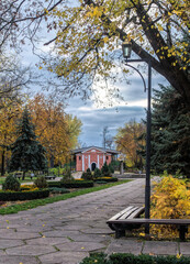 Empty wooden benches and picturesque autumn park