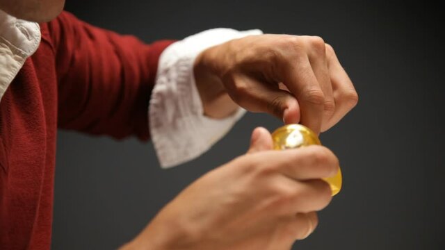Man is sharpening a pencil