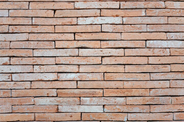 Abstract weathered textured red brick wall background. Brickwork stonework interior, rock old clean concrete grid uneven, horizontal architecture wallpaper.