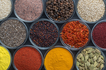 Assortment colorful spices, seeds and herbs for cooking food, top view