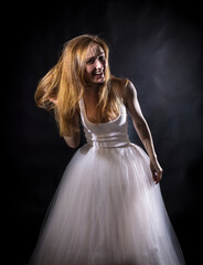 Young beautiful woman in a tutu studio portrait.