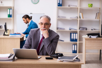 Two male colleagues working in the office