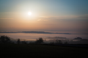 Sunrise over valley with fog in Luxembourg