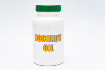 Health care - Nutritional supplement - Bottle of Coconut Oil. Isolated on a white background. Copy space.