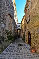 Fototapeta na wymiar A narrow street among the old houses of Castellabate, a medieval village in the Campania region, Italy. 
