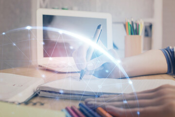 Social network theme hologram over woman's hands writing background. Concept of international people connect. Double exposure