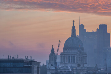 Fototapeta na wymiar Majestic lamndscape image of sunrise over London cityscape with stunning sky formations over iconic landmarks