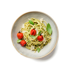 Pasta spaghetti with pesto sauce, grilled tomato and fresh basil leaves in gray bowl isolated on white  background. top view	