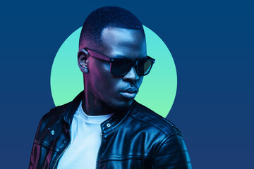 African man neon portrait, wearing trendy sunglasses and leather jacket