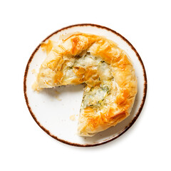Spanakopita, Greek spinach pie with feta cheese isolated on white background. top view
