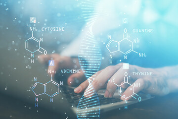 DNA hologram with businessman working on computer on background. Concept of bioengineering. Double exposure.